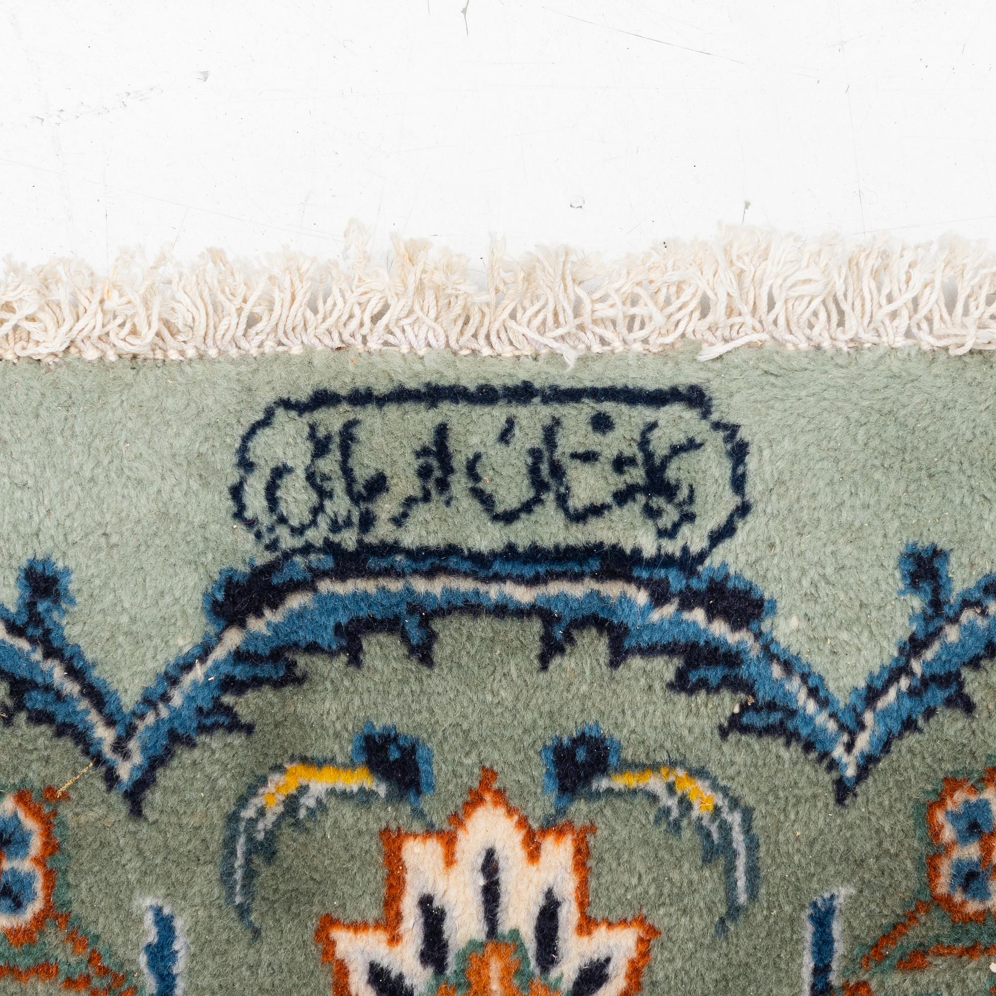 A Keshan carpet, signed, c. 376 x 270 cm.