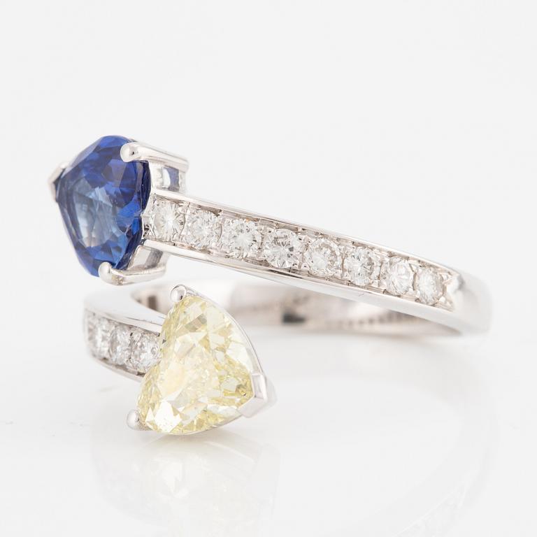 Ring, 18K white gold with a heart-shaped yellow diamond and sapphire, accompanied by GIA report.