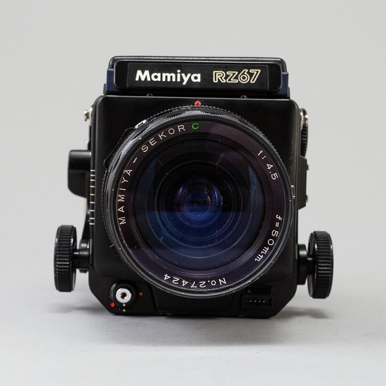 A black Mamiya RZ67 Pro Medium Format Camera Body with sekor z f = 110 mm 1:2.8 and sekor c f = 50 mm 1:4.5 lens.