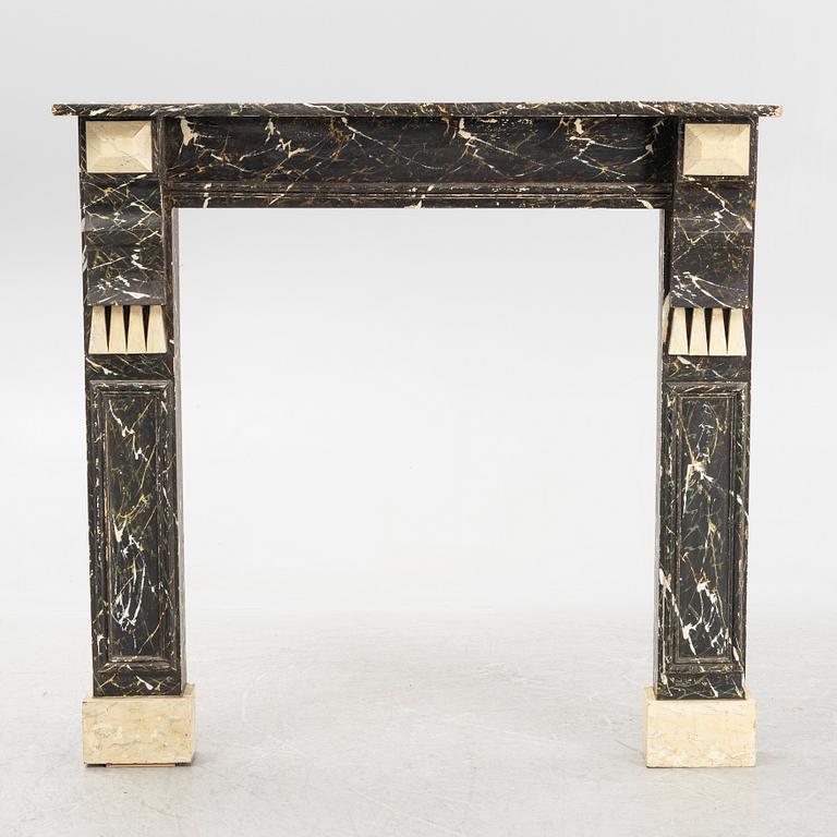 A fireplace surround, first half of the 20th Century.