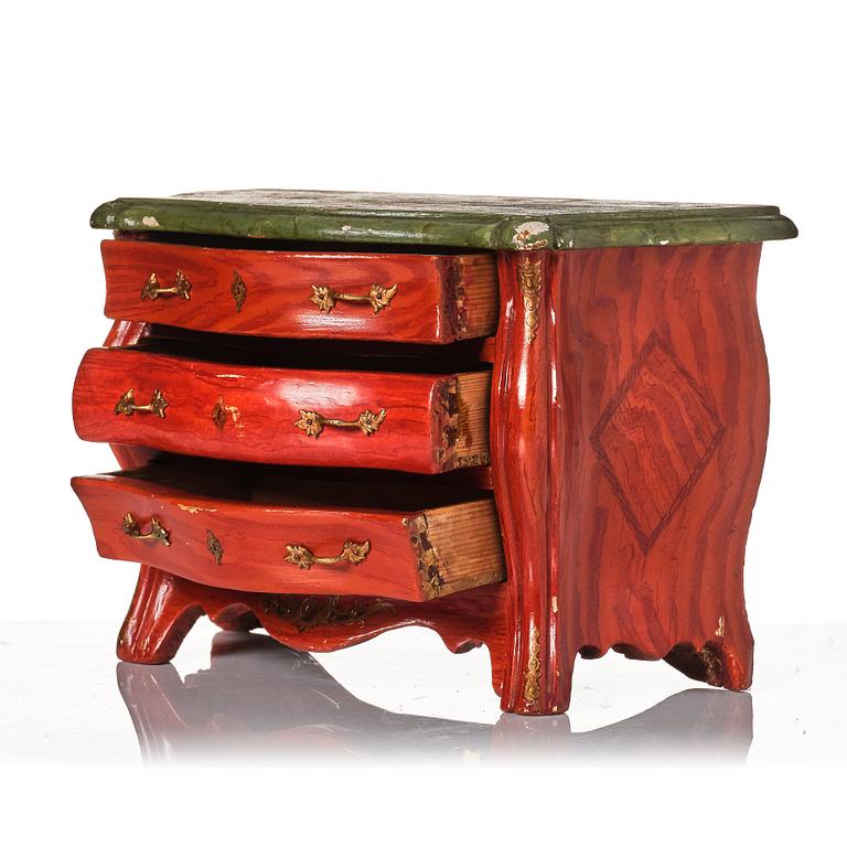 A painted miniature Rococo commode, later part of the 18th century.
