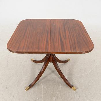 A mid 1900s English style mahogany dining table.