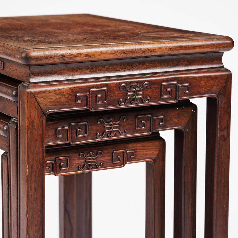 A Chinese hardwood three piece nesting table, early 20th century.