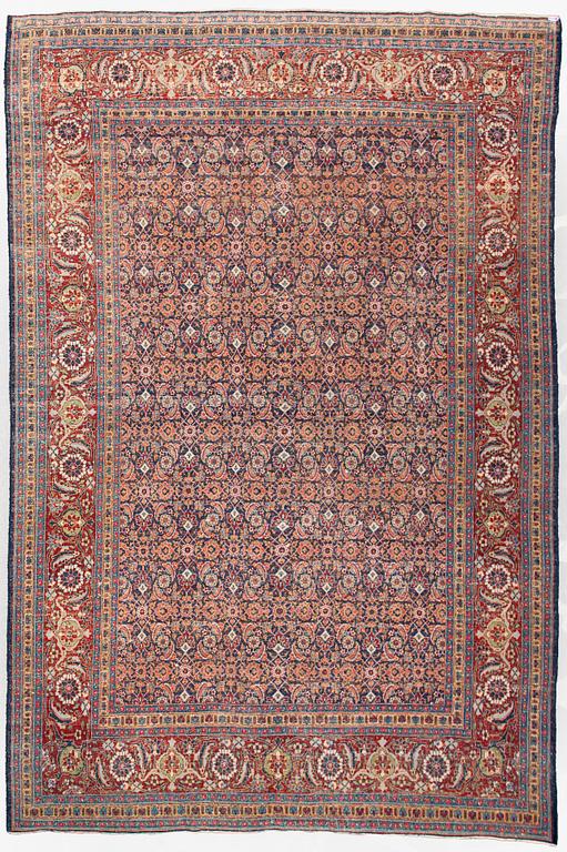 A carpet, a semi-antique Tabriz, ca 357 x 255 cm.