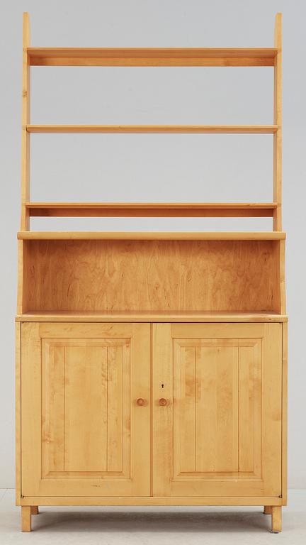 SKÅP MED HYLLA. Carl Malmsten, Åfors Möbelfabrik.