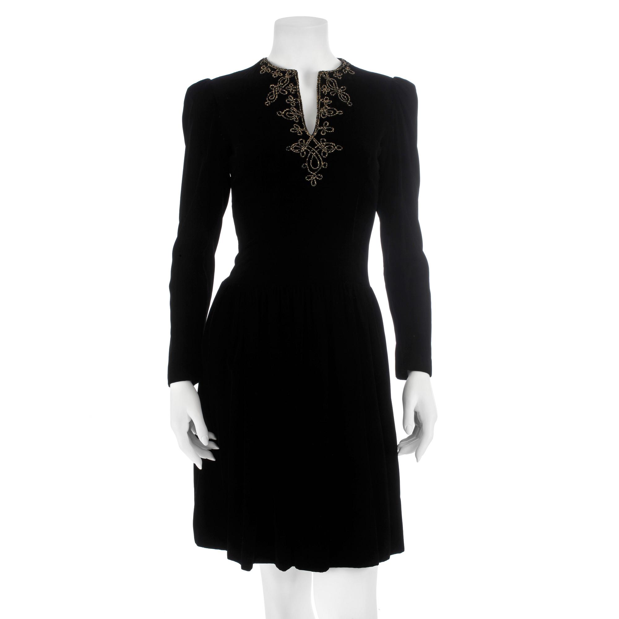 OSCAR DE LA RENTA, a black velvet dress with beading.