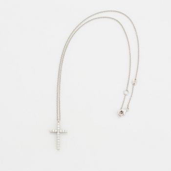 Brilliant-cut diamond cross pendant.