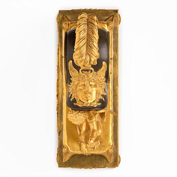 A French Empire sculptural ormolu and patinated bronze mantel clock, early 19th century.