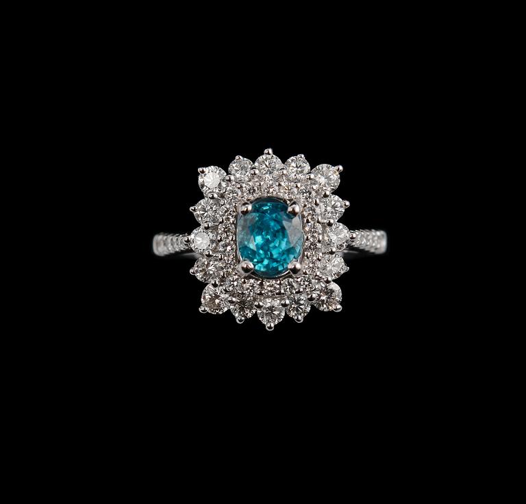 A RING, brilliant cut diamnonds c. 1.00 ct. zircon c. 1.2 ct. Weight 6,3 g.