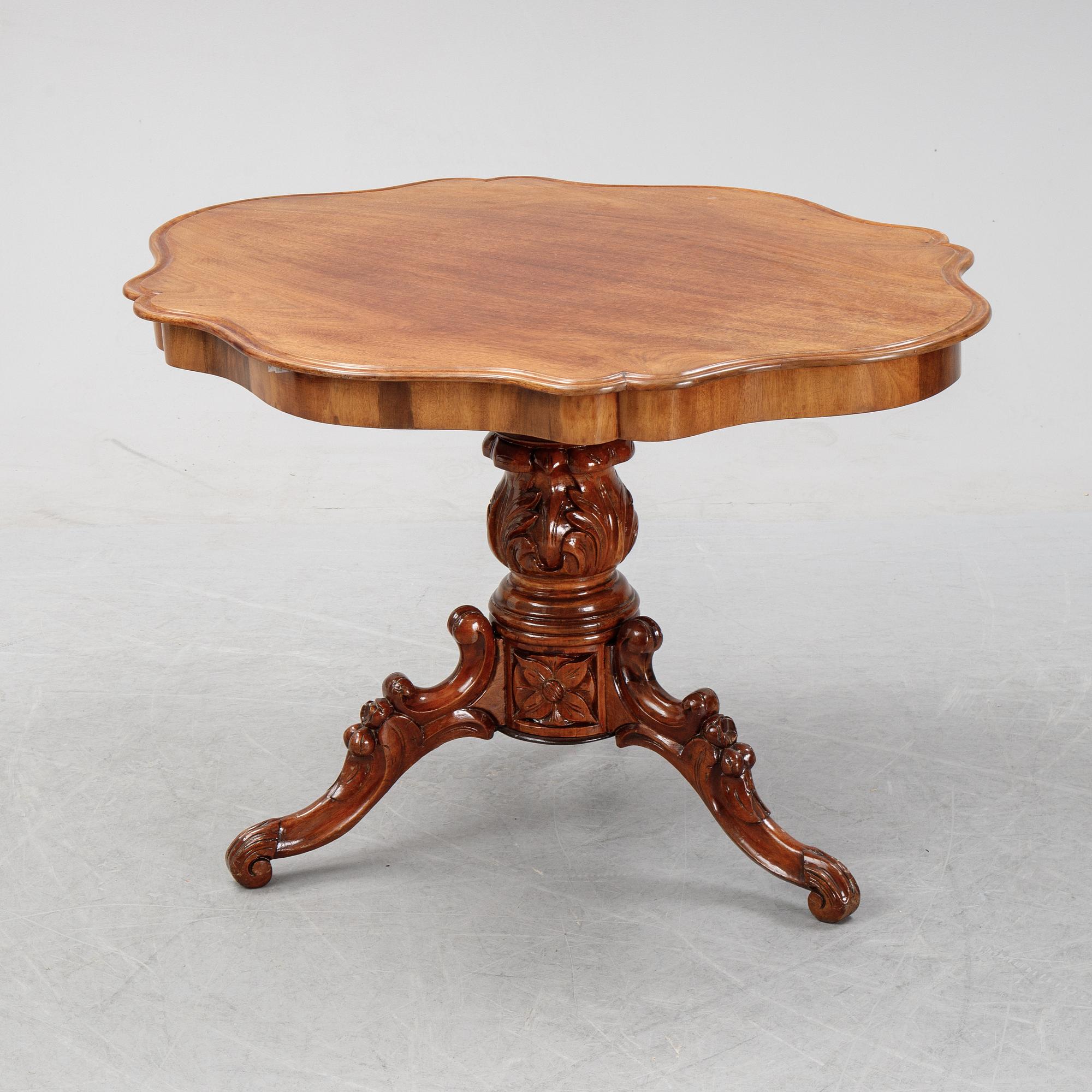 A rococo style sofa, four chairs and a table, second half of the 19th Century.