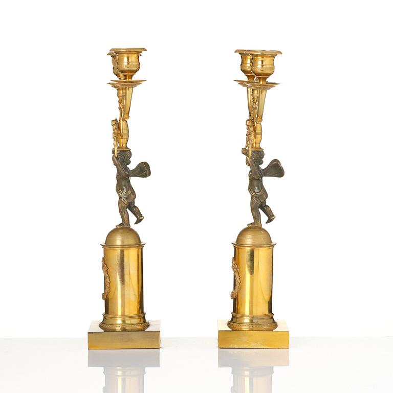 A pair of Empire gilt-brass two-branch candelabra, Stockholm, early 19th century.