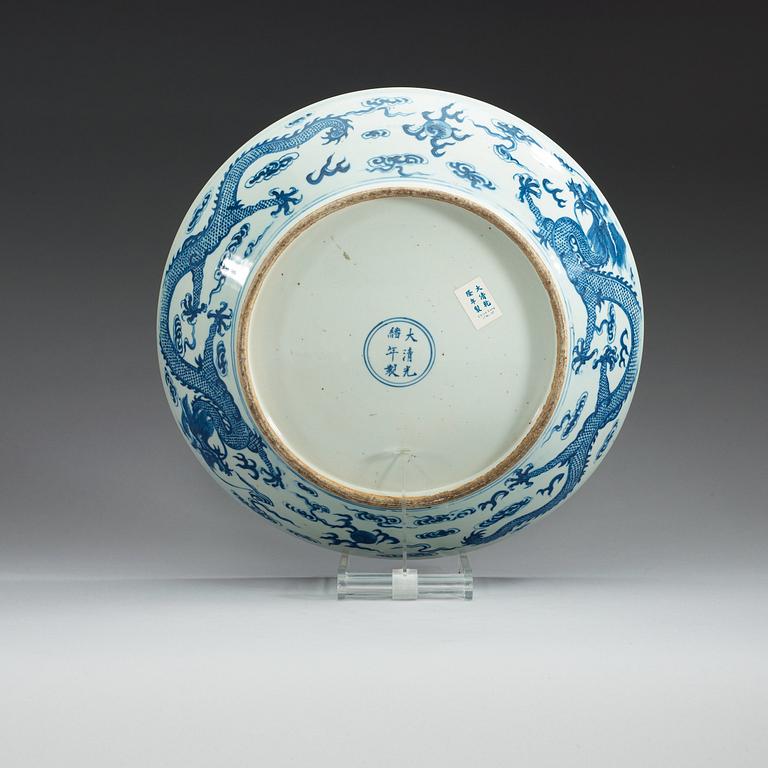 A large blue and white with five clawed dragon dish, Qing dynasty with Guangxu mark.