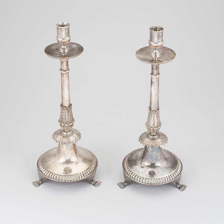 A pair of silver empire candlesticks by Aldolf Zethelius, Stockholm 1821 & 1824. 1284 g.