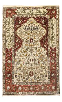 359. A silk and metal Hereke rug, c. 80 x 51 cm.