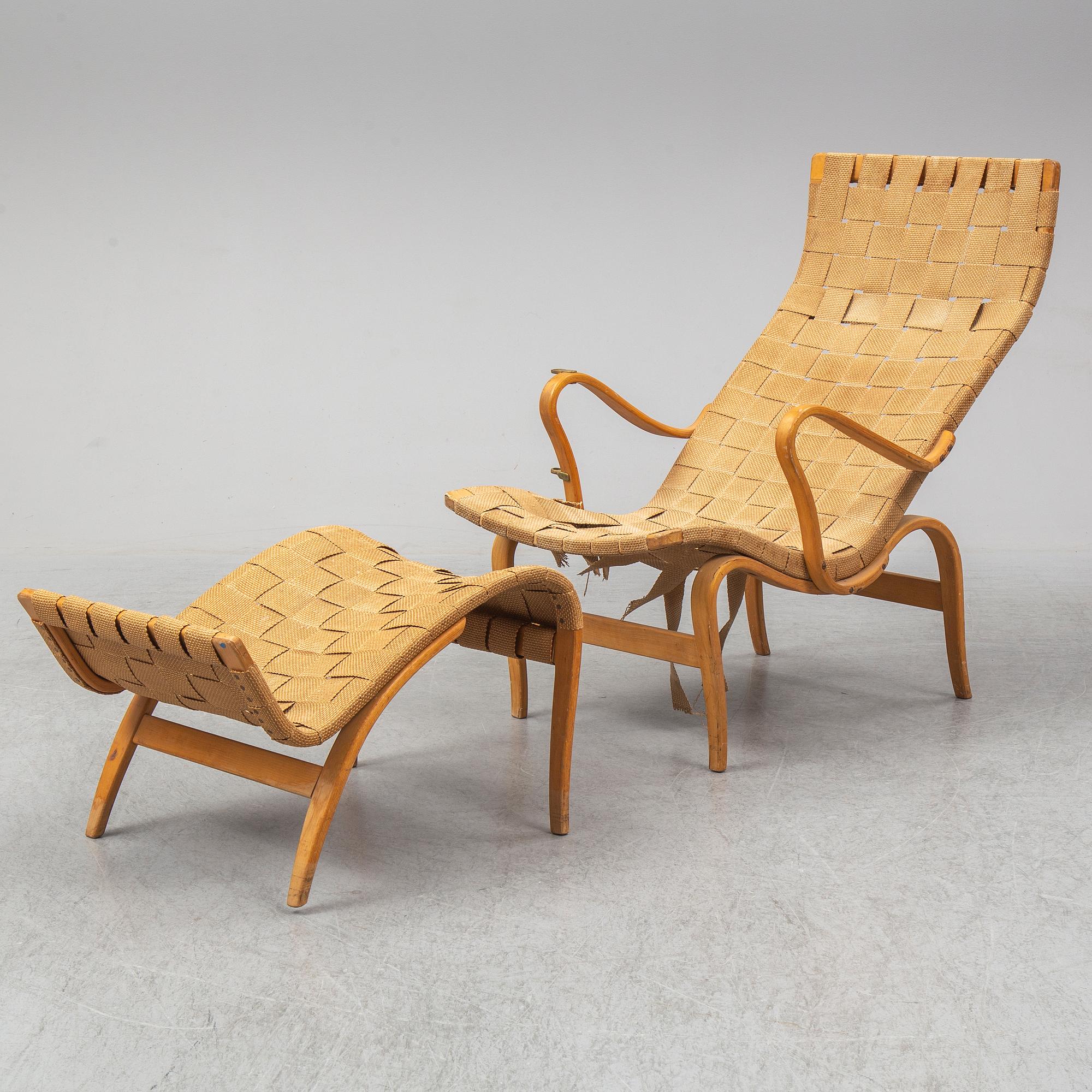 An mid 20th Century easy chair  and stool by Bruno Mathsson for Karl Mathsson Värnamo.