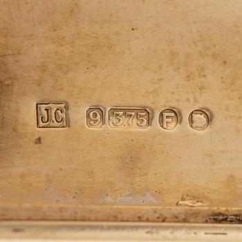 A Cartier 9 carat gold and calibré-cut sapphires cigarette case, London.