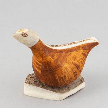 Lars Levi Sunna, a grouse reindeer horn and birch figurine, signed LL Sunna.