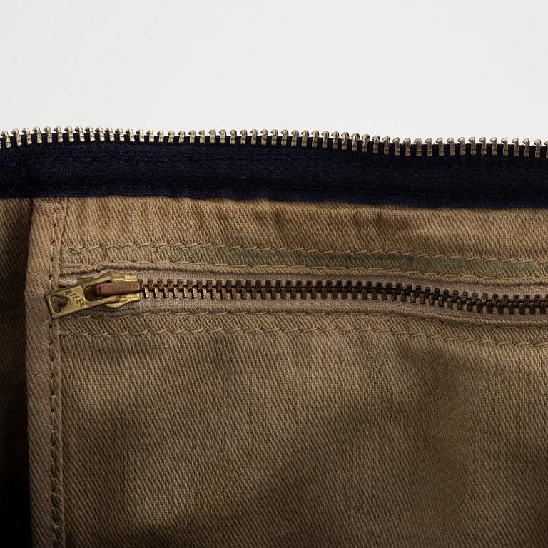 Christian Dior, a canvas handbag, toilet bag and key holder.