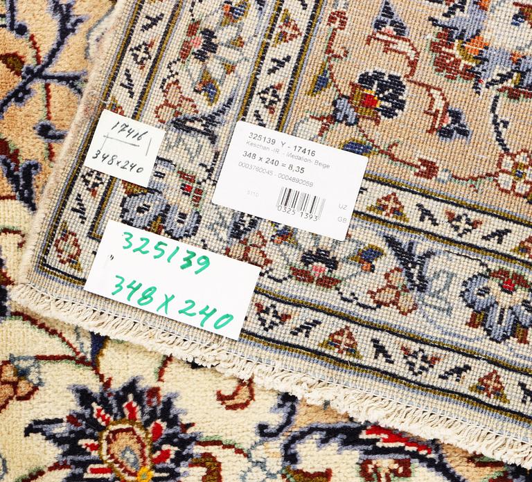 A Keshan carpet, c. 348 x 240 cm.
