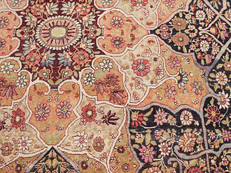 An antique Kerman Laver carpet, c. 586 x 385 cm.