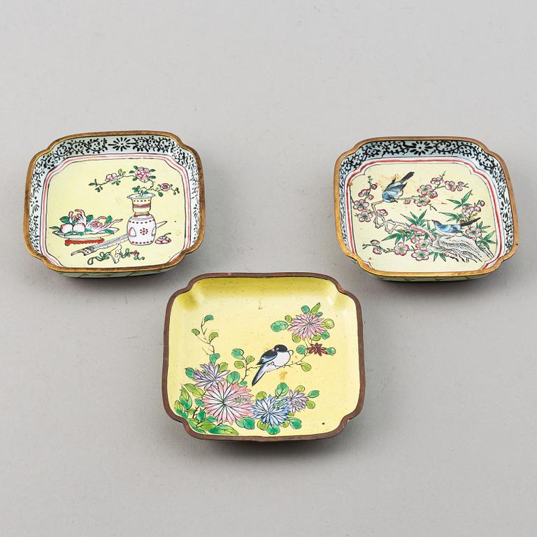 A set of 23 enamel on copper dishes, China, early 20th Century.