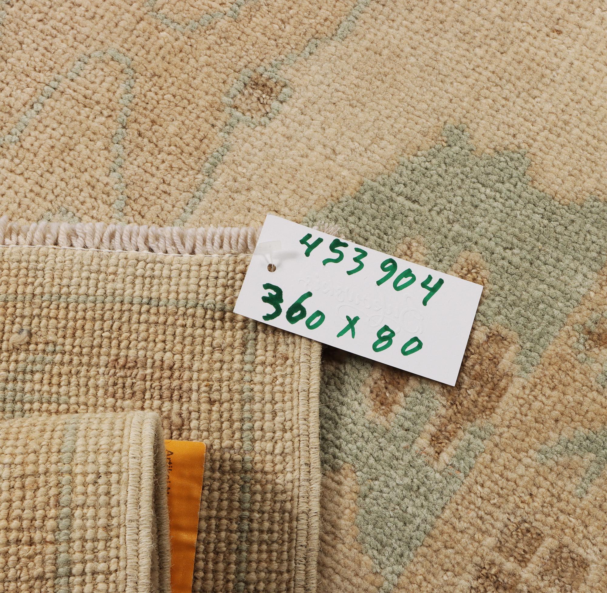 An Ushak runner carpet, c. 360 x 80 cm.