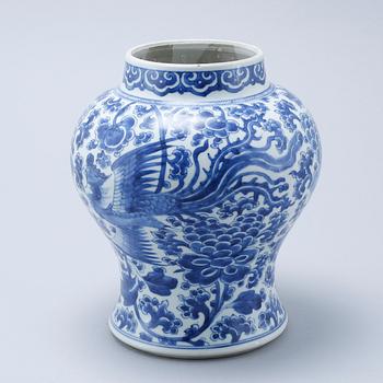 A blue and white Chinese Kangxi vase.