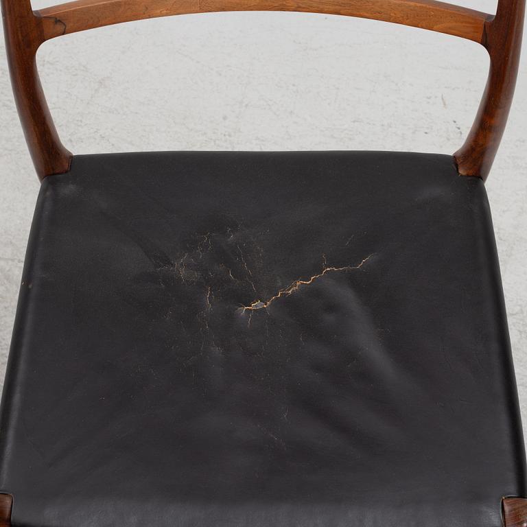 Niels Otto Møller, a rosewood dining table and eight rosewood chairs, Poul Jeppesen & JL Möller, Denmark, 1960's.