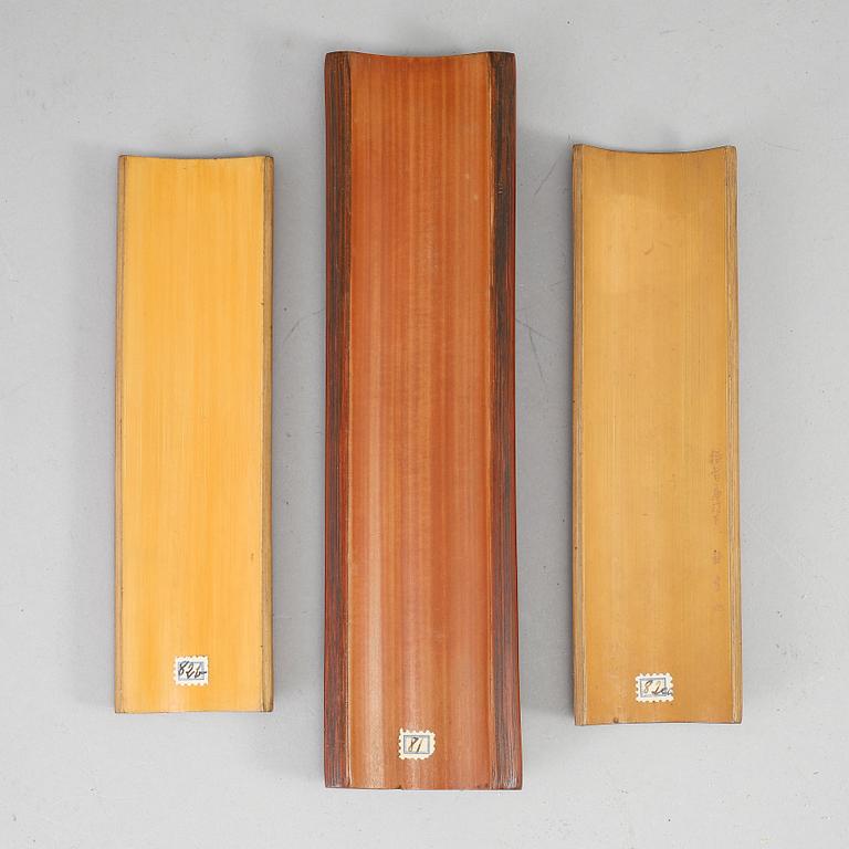 A set of three bamboo wrist rests, presumably early 20th Century, with inscriptions.