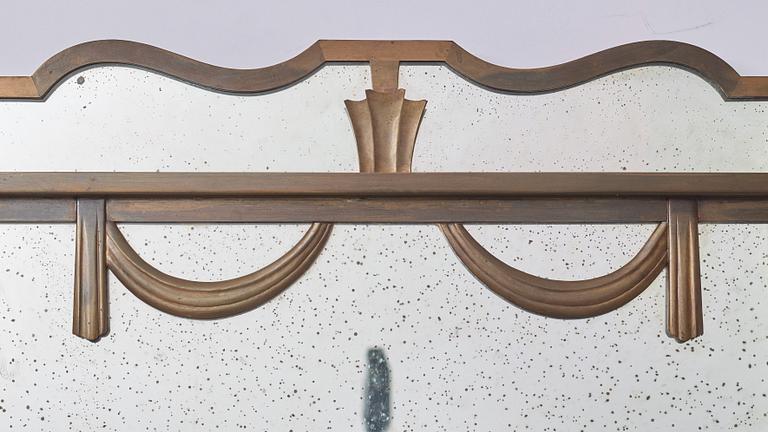 Swedish Grace, a brass framed wall mirror, 1920-30s.