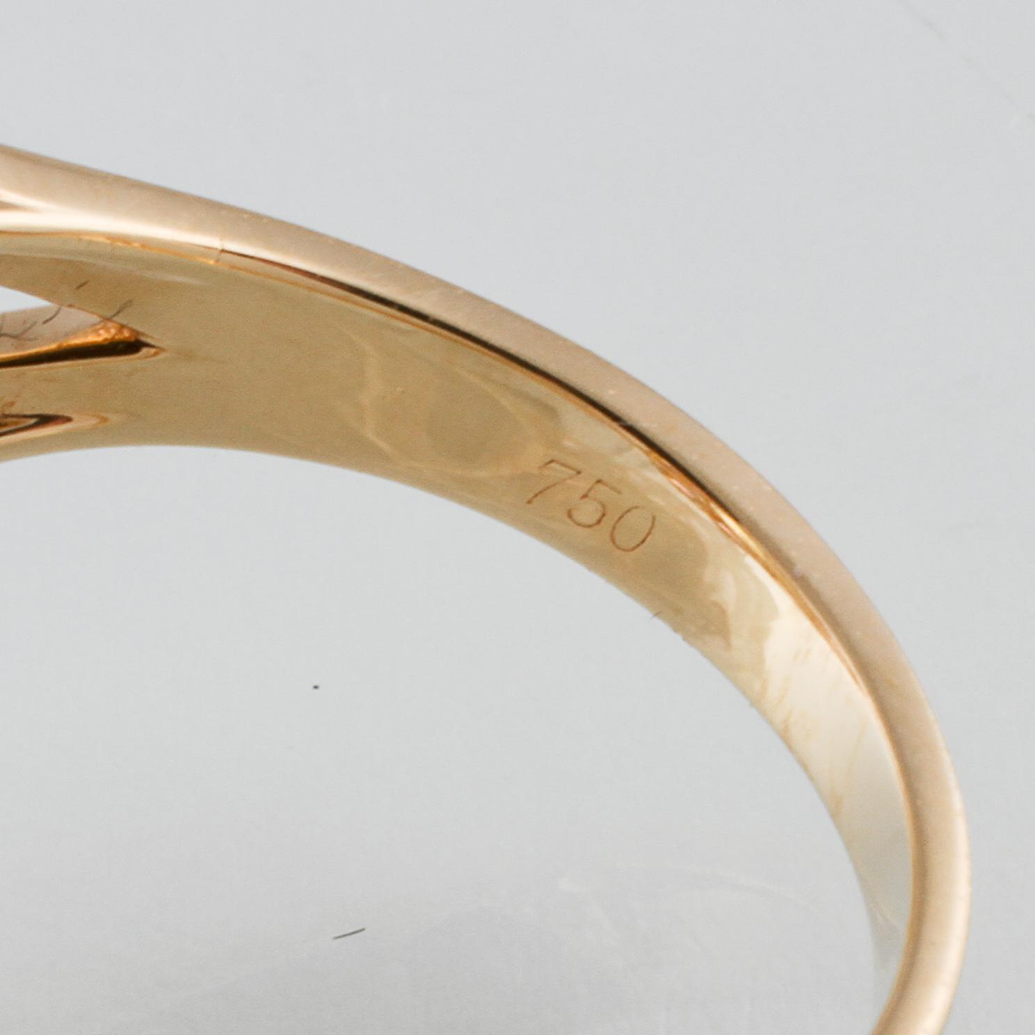 RING, 18K guld med ovalslipad topas ca 6.21 ct samt rosa safirer ca 2.25 ct. Vikt 6,2 gram.