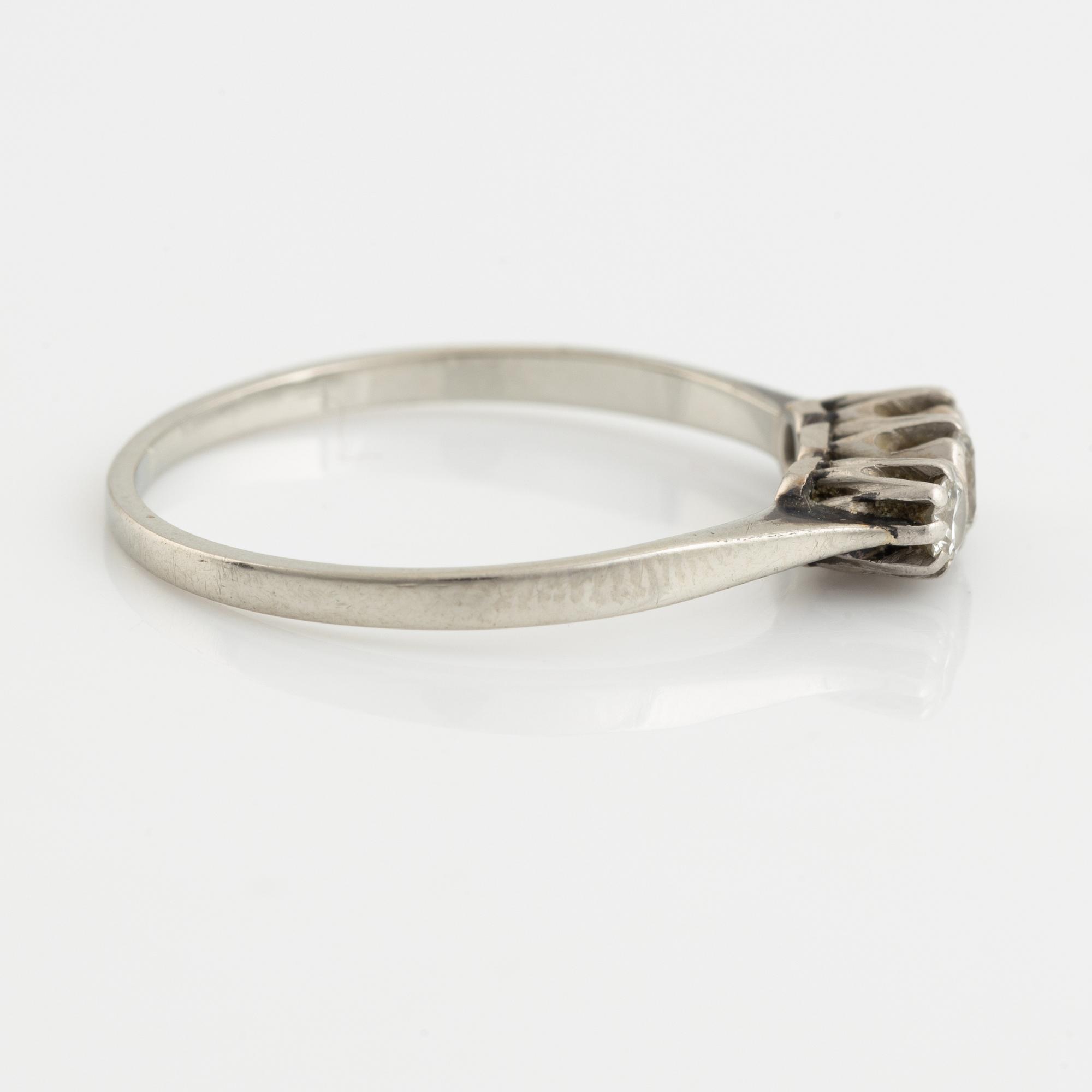 White gold and three brilliant cut diamond ring.