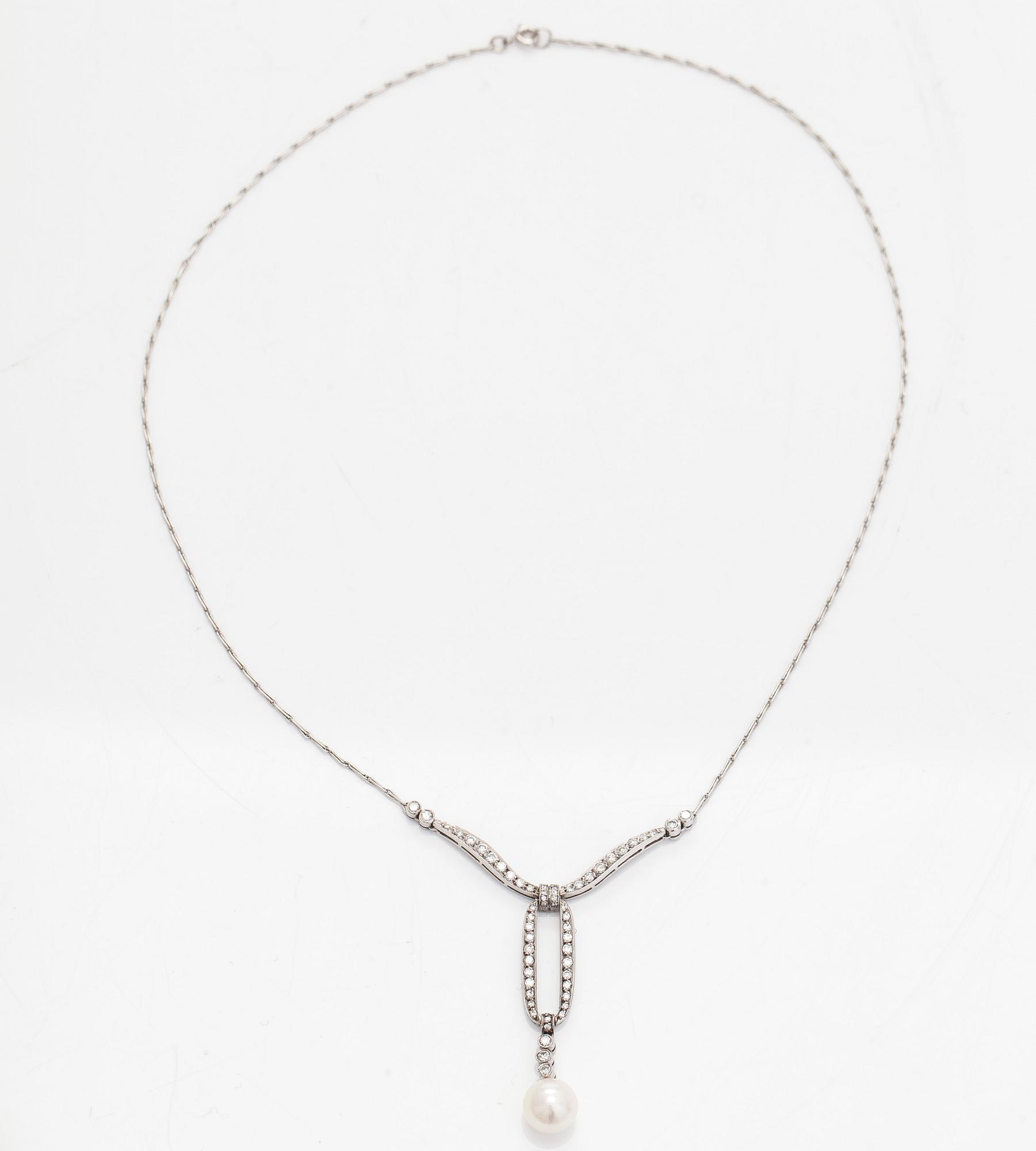 An 18K white gold necklace with brilliant-cut diamonds and a cultured pearl, England.