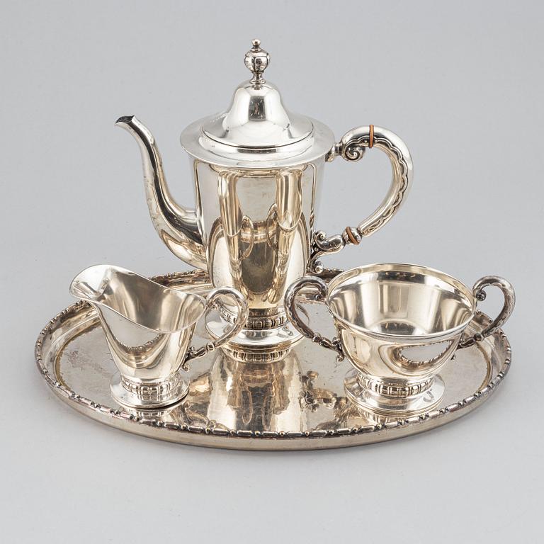 A silver coffee pot, creamer and sugar bowl, CG Hallberg Stockholm 1932-39.