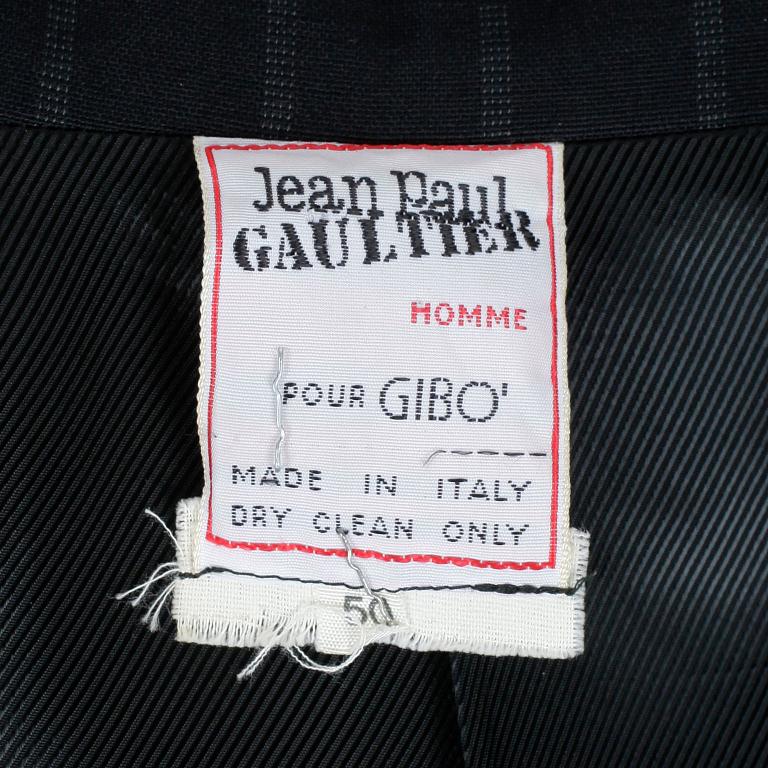 JEAN-PAUL GAULTIER, a black woolblend pinstriped men's jacket and pants. Size 50.