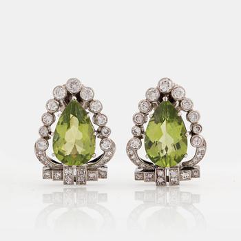 A PAIR OF EARRINGS set with peridots.