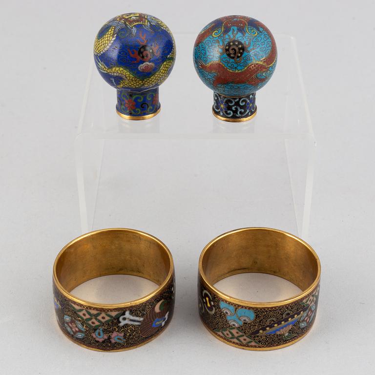 Two cloisonné cane tops and two napkin rings, China, first half of 20th Century.