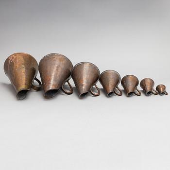 7 Swedish measuring cups from 20th century.