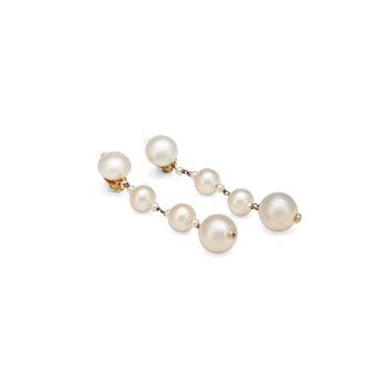748. CHANEL, a pair of decorative pearl earclips set in gold colored metal.