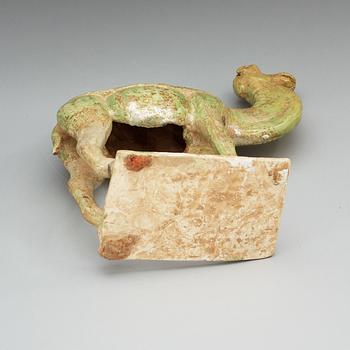A potted green glazed figure of a camel, Tang dynasty, (618-907).