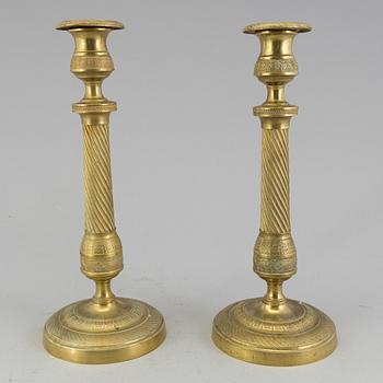 A pair of 'Empire' candlesticks, probably French.