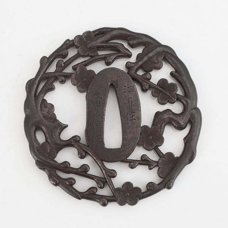 A signed iron tsuba, 18th Century.