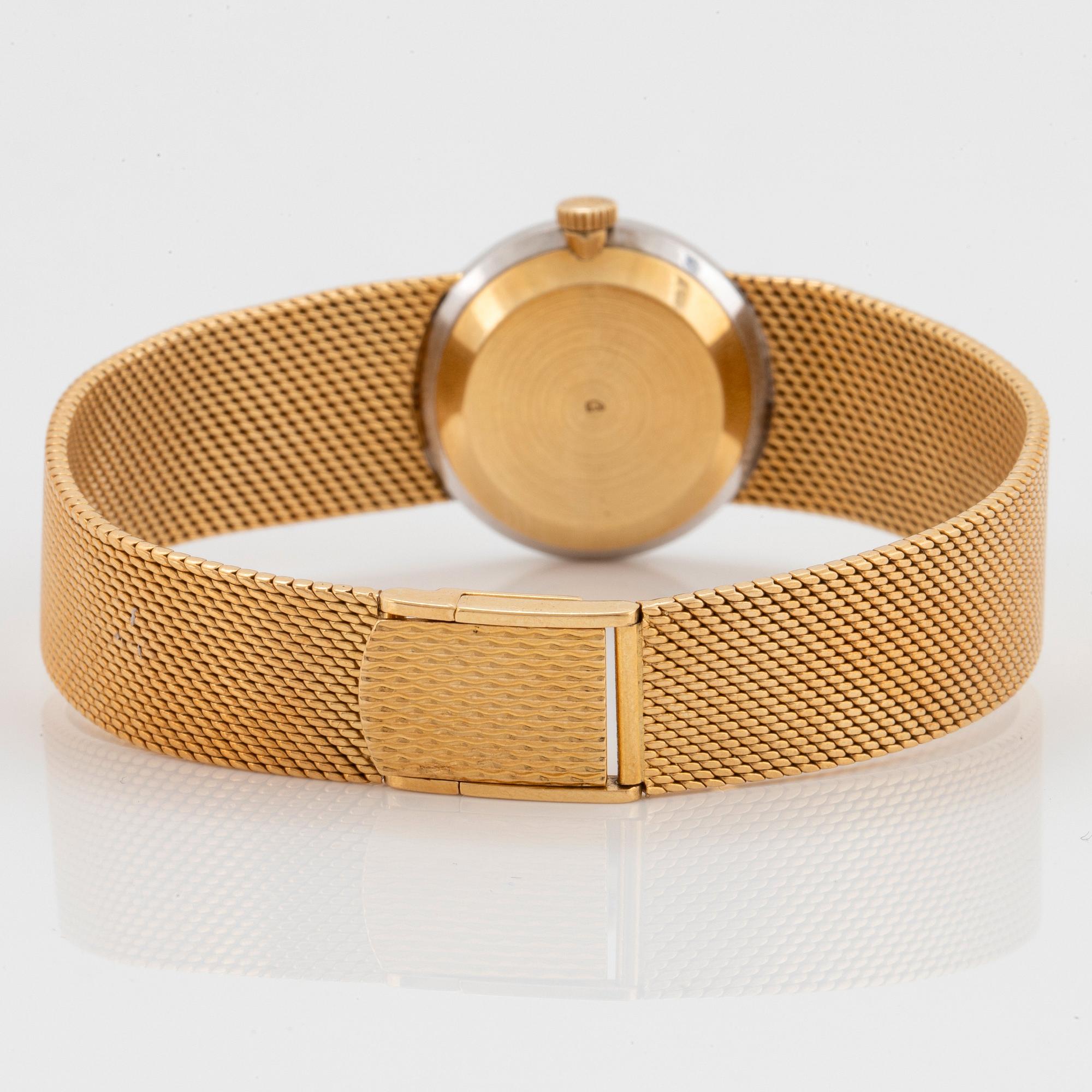 A Chopard wrist watch in 18K gold set with eight-cut diamonds.
