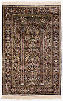 A Quum rug, part islk, ca. 195 x 127 cm.