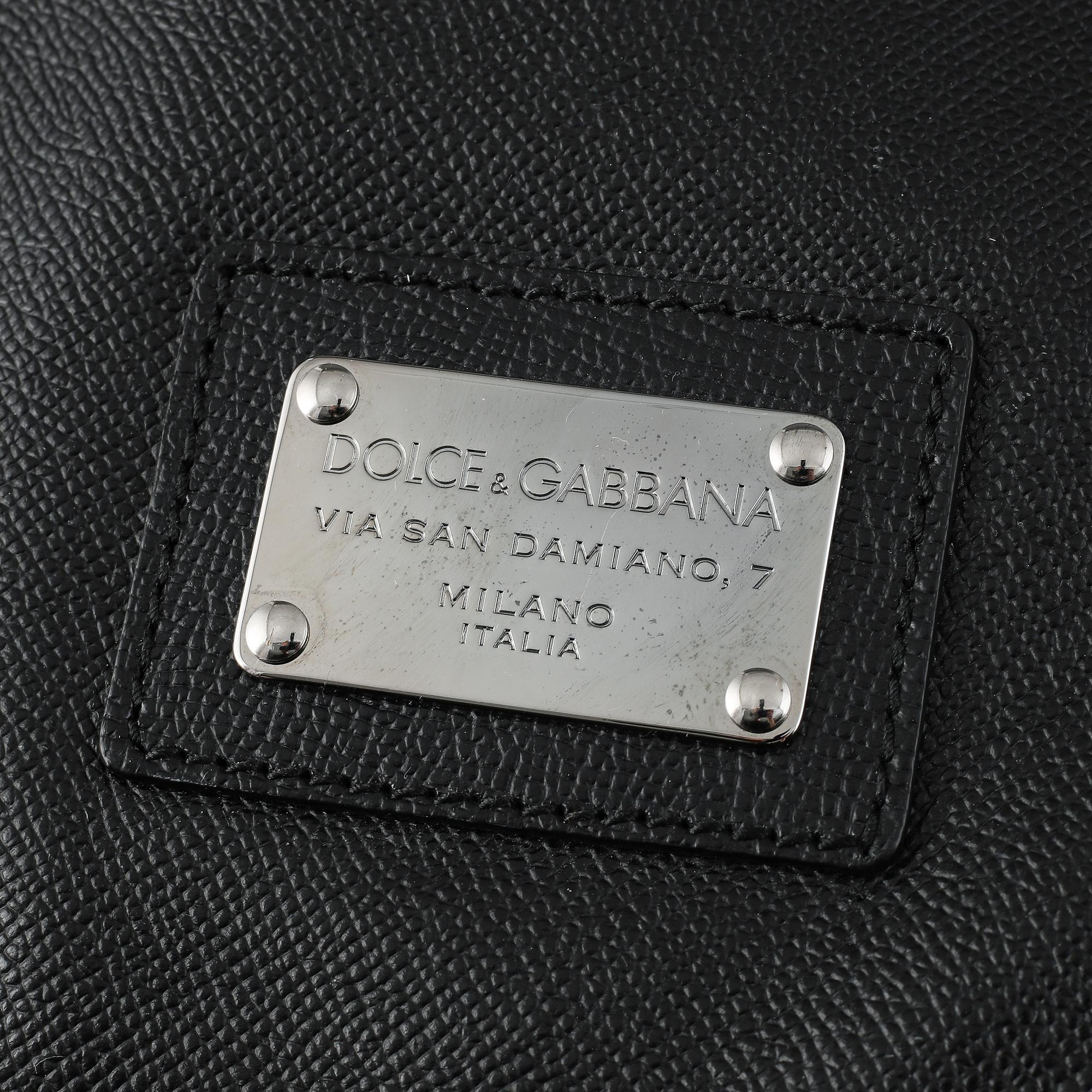 Dolce & Gabbana, a black leather weekend bag.