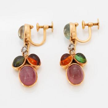 A pair of WA Bolin earrings.