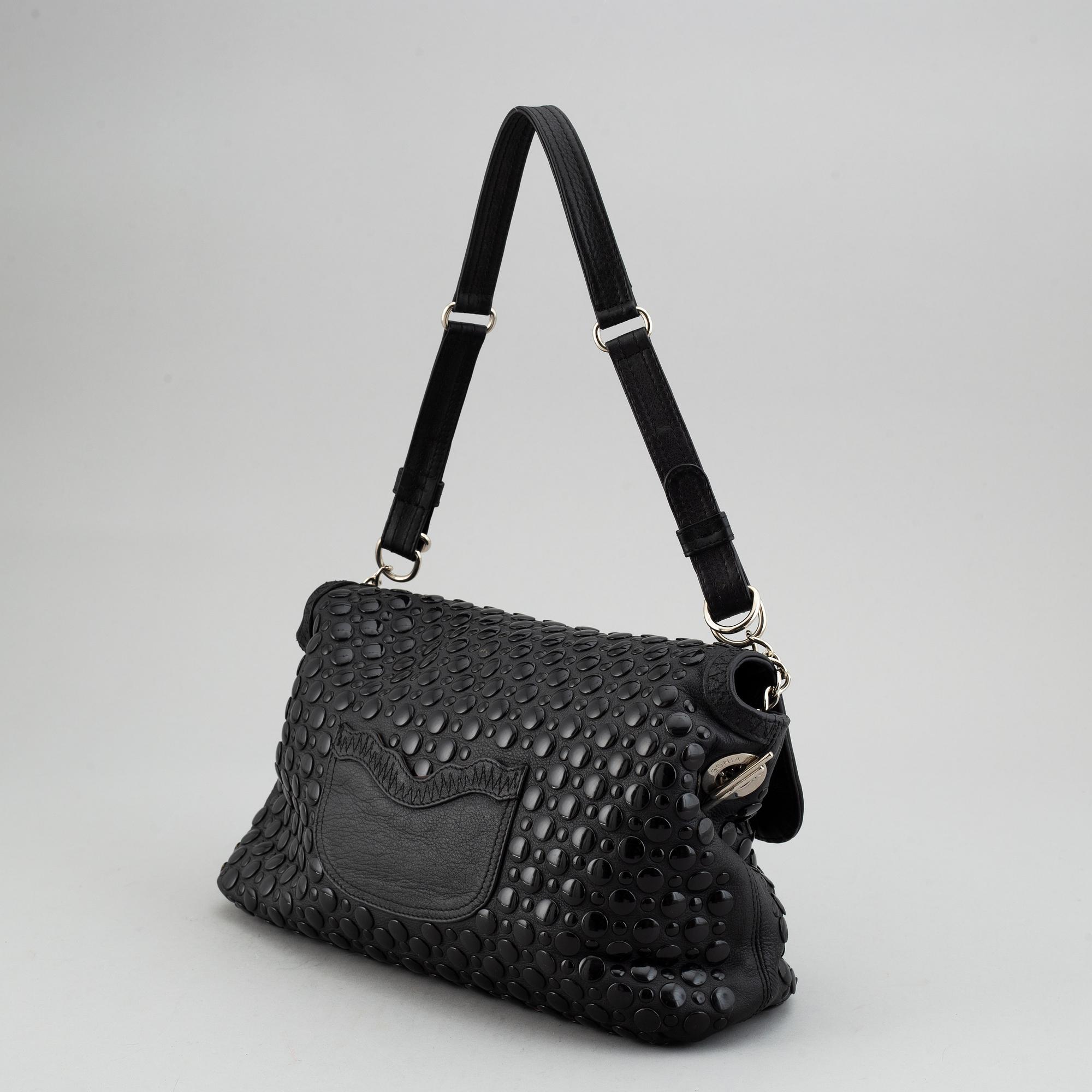 SONIA RYKIEL, a black leather bag.