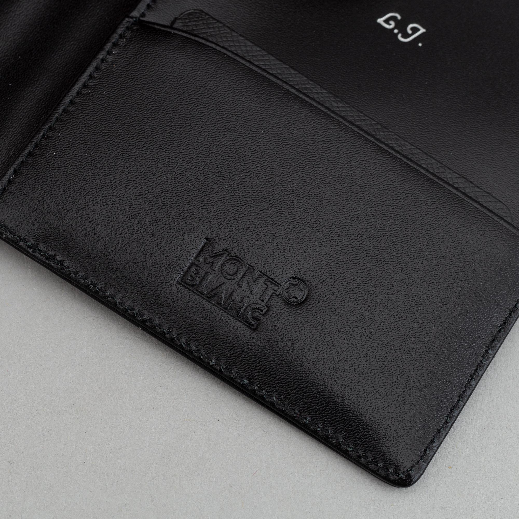 MOntblanc, a ball point pen and leather passport holder.