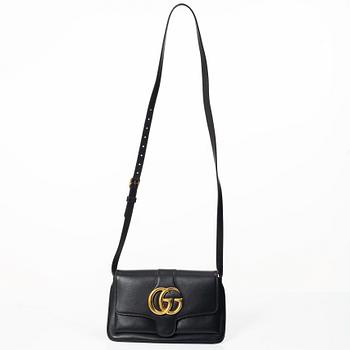Gucci, a handbag.