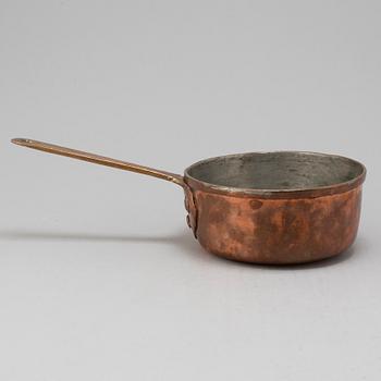 A copper saucepan marked FG 1756.